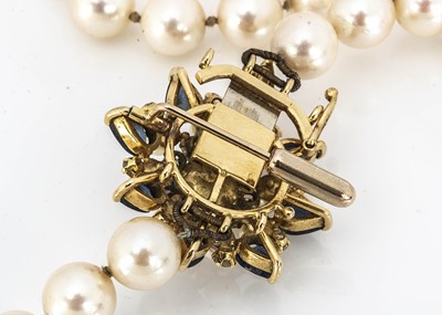 Lot 203 - An opera length uniform cultured knotted pearl necklace