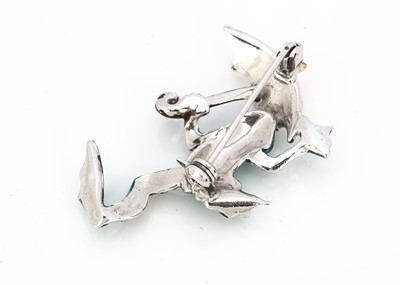 Lot 206 - A comical enamel chrome plated and marcasite frog brooch
