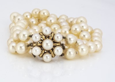 Lot 209 - A cultured pearl three strand cultured pearl bracelet
