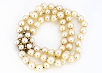 Lot 209 - A cultured pearl three strand cultured pearl bracelet