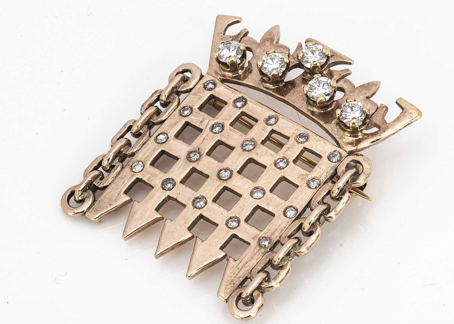 Lot 217 - A yellow metal diamond and cz set House of Commons speakers brooch
