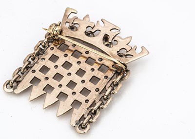 Lot 217 - A yellow metal diamond and cz set House of Commons speakers brooch