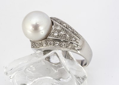 Lot 219 - A contemporary 18ct white gold diamond and cultured pearl dress ring