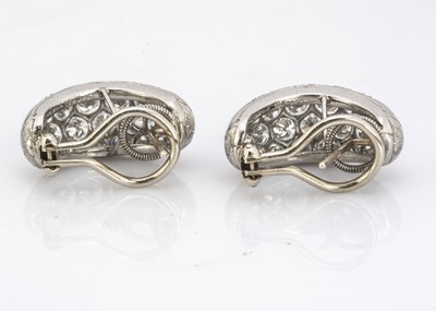 Lot 221 - A pair of Oscar Heyman of New York diamond encrusted cuff earrings