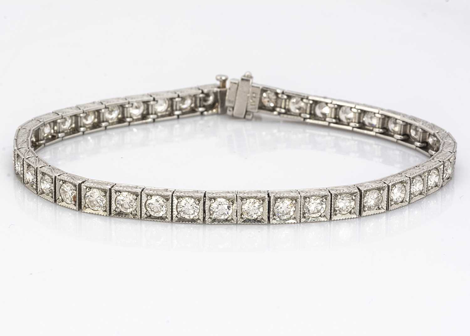 Lot 223 - A platinum and diamond tennis bracelet