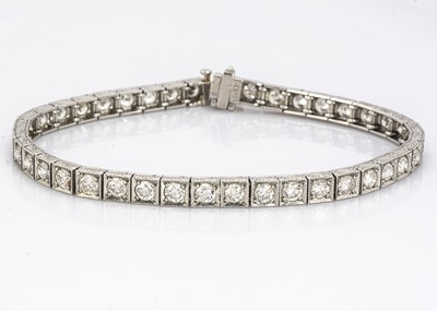 Lot 223 - A platinum and diamond tennis bracelet