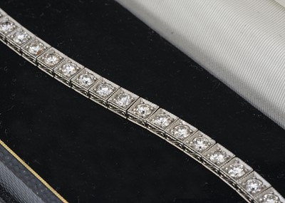 Lot 223 - A platinum and diamond tennis bracelet