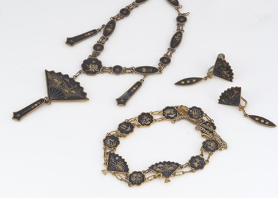 Lot 9 - A Japanese Shakudo necklace, Meiji in period