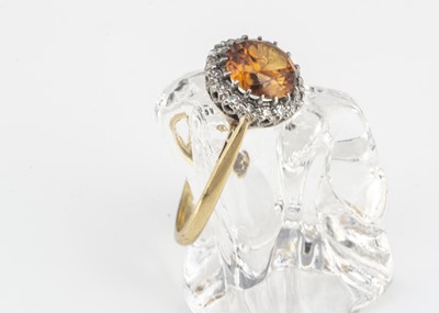 Lot 22 - An 18ct gold zircon and diamond dress ring