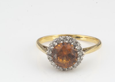 Lot 22 - An 18ct gold zircon and diamond dress ring
