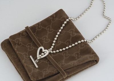 Lot 24 - A Gucci silver heart necklace