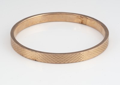 Lot 56 - A late Victorian 9ct gold arm bangle