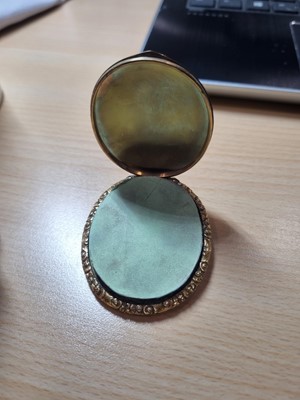 Lot 65 - A 19th Century gilt metal and photographic oval locket