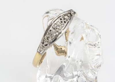 Lot 80 - An 18ct gold and platinum three stone diamond dress ring