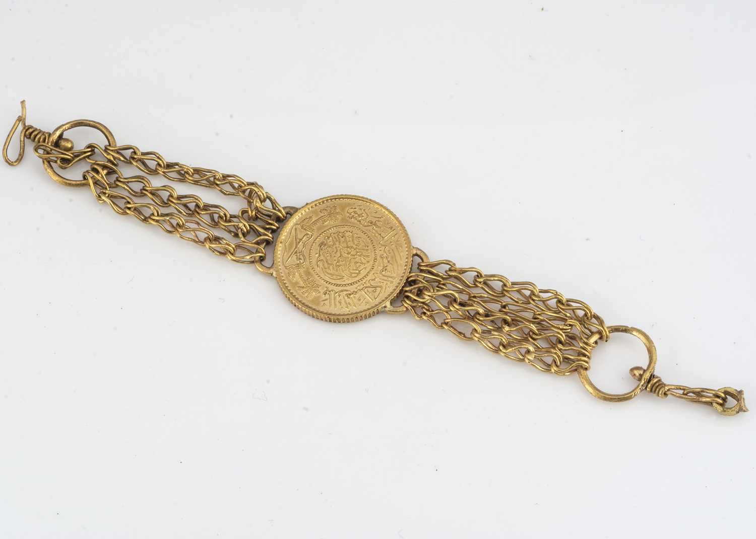 Lot 90 - A Middle Eastern high carat gold coin bracelet