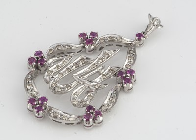 Lot 91 - A white gold diamond and ruby openwork pendant brooch