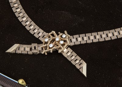 Lot 94 - A 9ct gold Hamilton Laidlaw boxed diamond bow necklace