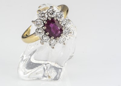 Lot 108 - An 18ct gold ruby and diamond cluster ring