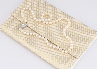 Lot 114 - A string of Mikimoto uniform knotted strung cultured pearls