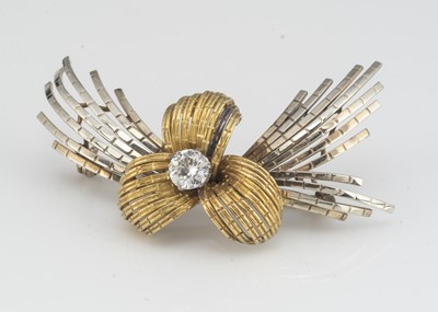 Lot 116 - A continental 18ct gold two colour gold diamond bow brooch