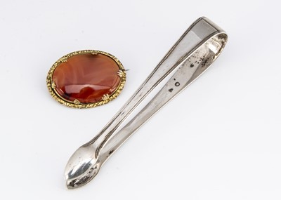 Lot 122 - A 19th Century pinchbeck oval carnelian pin brooch