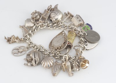 Lot 123 - A silver curb link charm bracelet