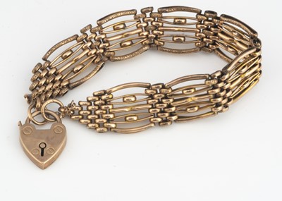 Lot 124 - A 9ct gold gate link rose gold bracelet and heart shaped padlock clasp