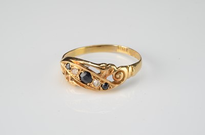 Lot 158 - An 18ct gold sapphire and diamond crossover engagement ring