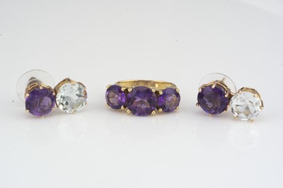 Lot 189 - An 18ct gold amethyst and diamond three stone dress ring