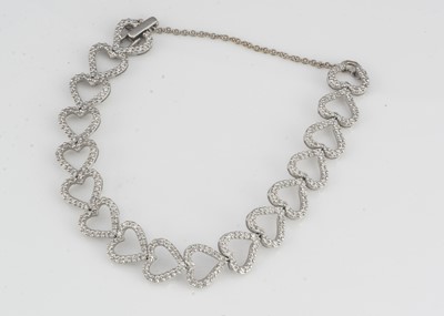 Lot 203 - A continental 18K marked diamond bracelet