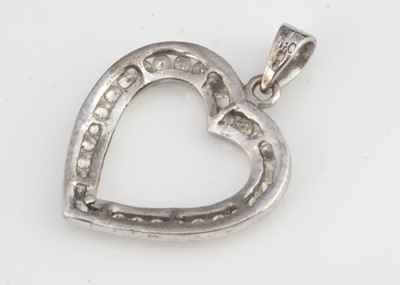 Lot 214 - A 9ct white gold and diamond set open heart pendant