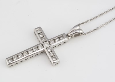 Lot 216 - A 9ct gold diamond set cross pendant