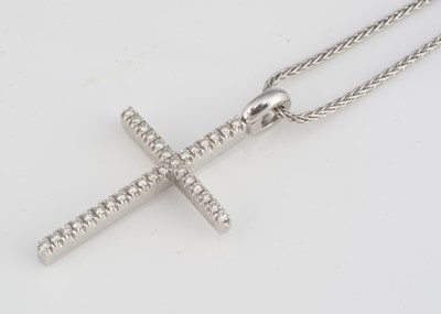 Lot 217 - An 18ct gold diamond set cross pendant