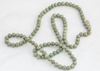 Lot 225 - A 19th Century green jadeite jade bead necklace