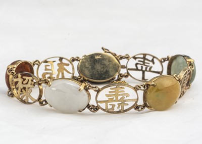 Lot 226 - A Chinese 14K marked yellow metal and hardstone bracelet