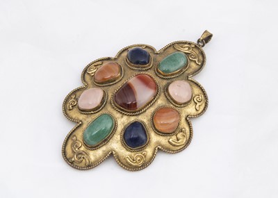 Lot 266 - A gilt metal shaped pendant