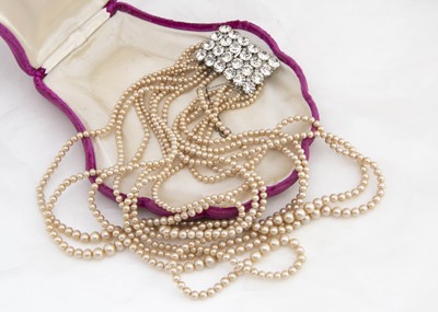 Lot 267 - A paste and simulated multi strand necklace