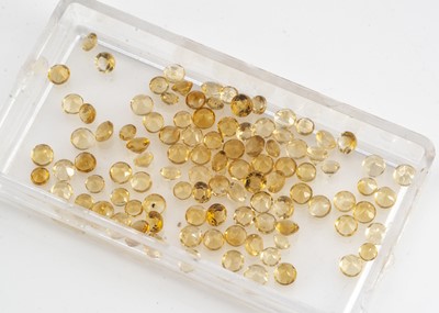 Lot 271 - A collection of small mixed round cut yellow sapphires