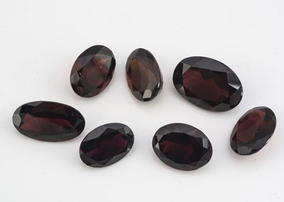 Lot 272 - A collection of seven oval mixed cut garnets