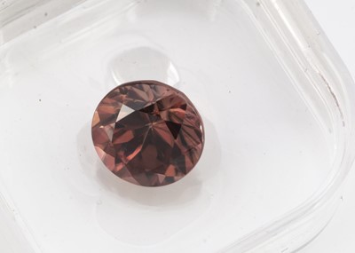 Lot 292 - A certificated round cut large Zircon