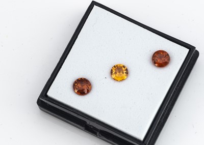 Lot 305 - Three certificated garnets