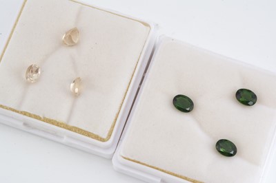 Lot 307 - Two gem cases containing three oval and pear cuts gems