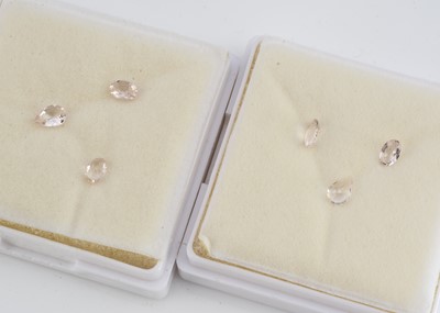 Lot 308 - Two gem cases containing three oval and pear cut beryls