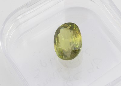 Lot 327 - A certificated oval cut sphene