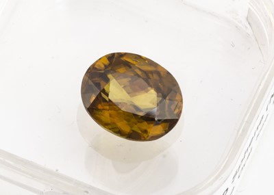 Lot 344 - A certificated oval cut sphene