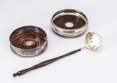 Lot 375 - A modern silver and wooden wine bottle coaster and toddy ladle