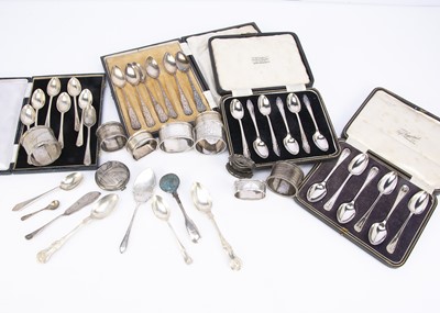 Lot 428 - A collection of silver teaspoons and napkin rings