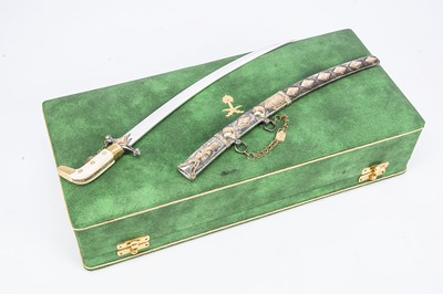 Lot 441 - A second half 20th century presentation precious metal sword and scabbard