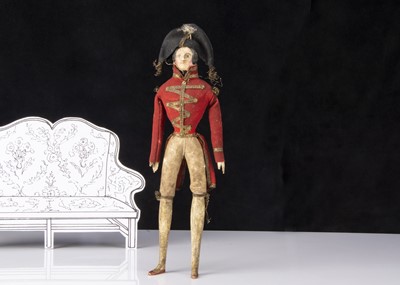 Lot 13 - A rare 19th century German papier-mache shoulder-head soldier doll probably in 18th century British uniform