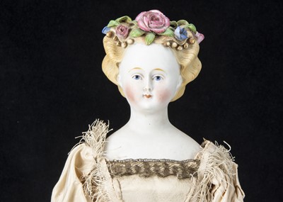 Lot 18 - A fine German bisque shoulder-head lady doll with flowers in hair